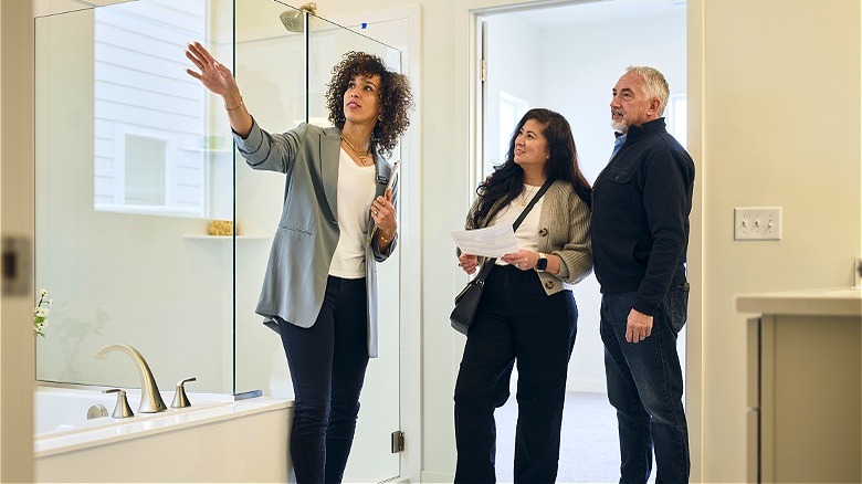 Agent showing buying couple home