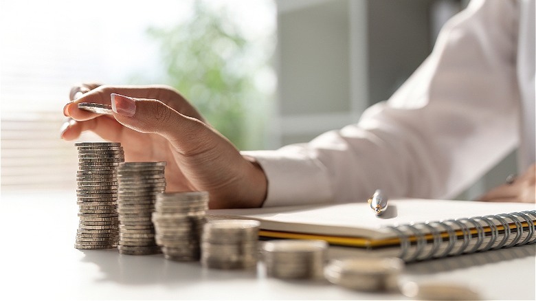 Person counting coins