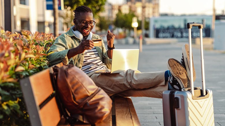 Man on vacation with credit card