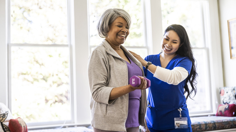 Elderly woman and her nurse