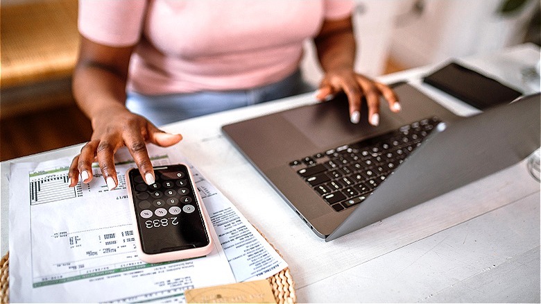 Person making calculations at home
