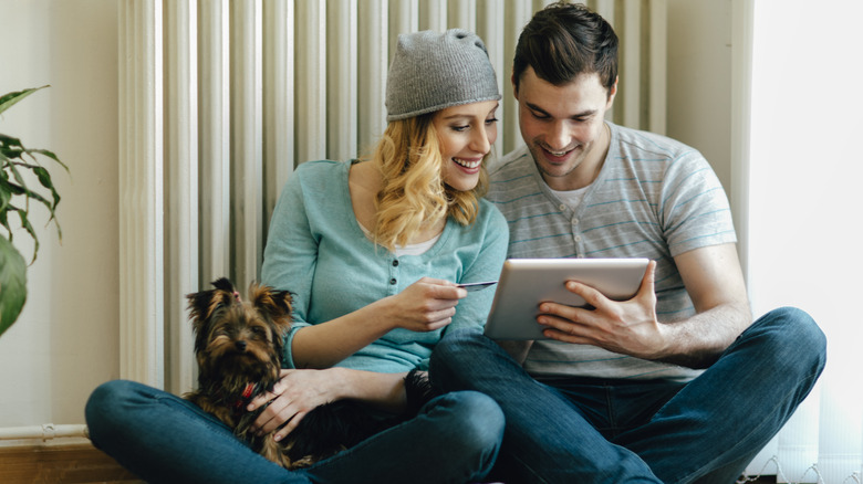 couple looking at tablet