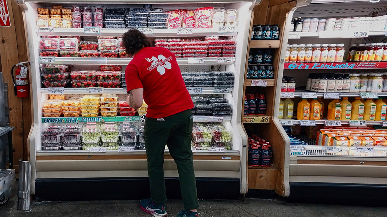A Trader Joe's employee checks shelves inside a store in Los Angeles