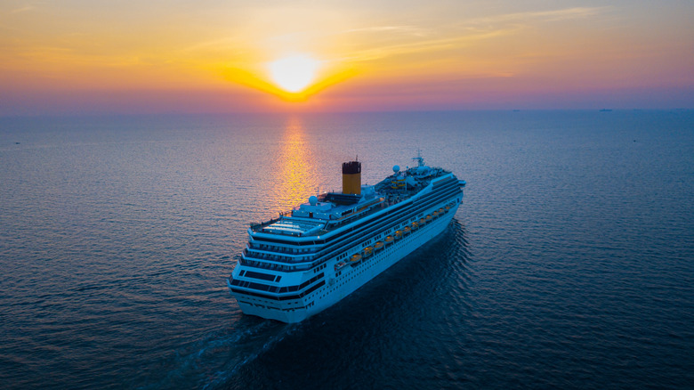 Cruise ship sailling at sunset.
