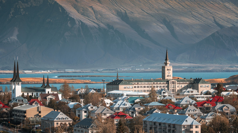 View of city with water and mountains in the background