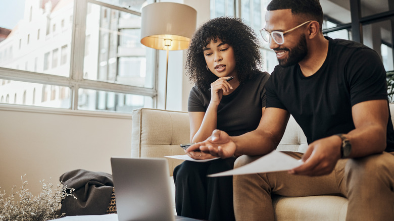 Couple looking at laptop