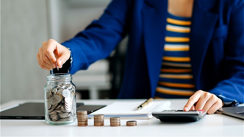 Person saving money and budgeting