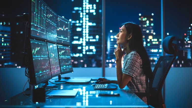 Person reviewing digital currency charts