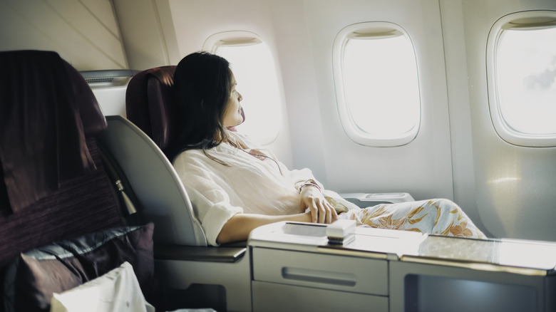 woman sitting in a first-class seat