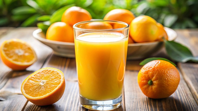 glass of orange juice on a table