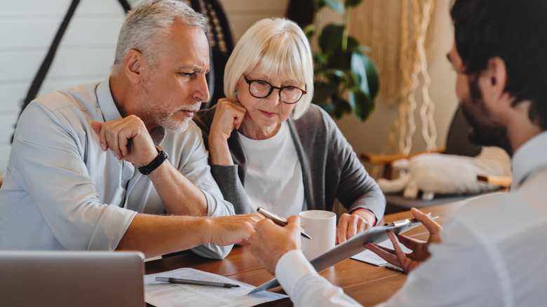 senior couple meeting with a financial advisor