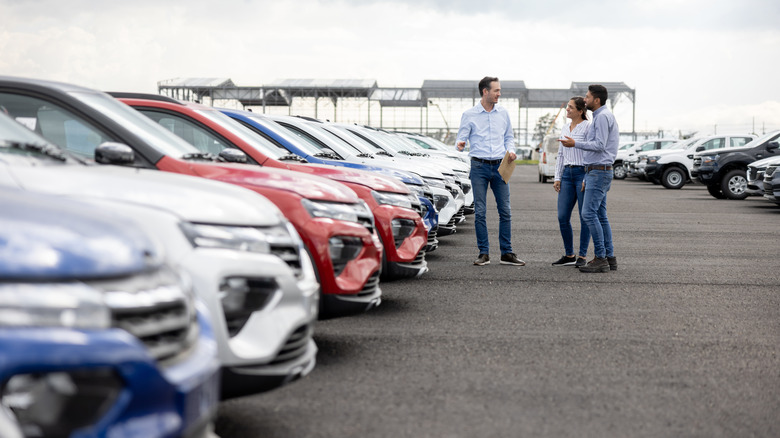 car buyers at dealership