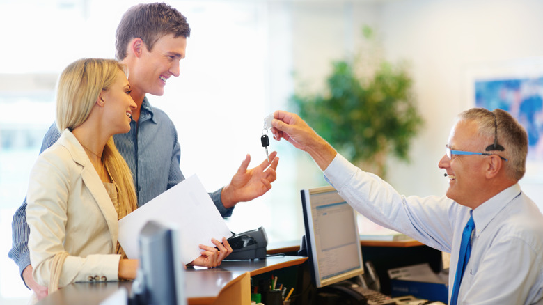 couple receiving car keys