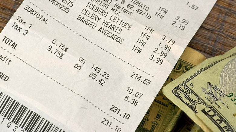 Grocery receipt and $20 bill