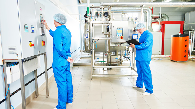 Two men inspect equipment