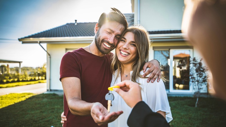 A couple receives housekeys