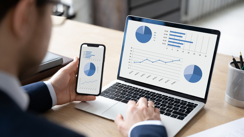 A man checks a graph