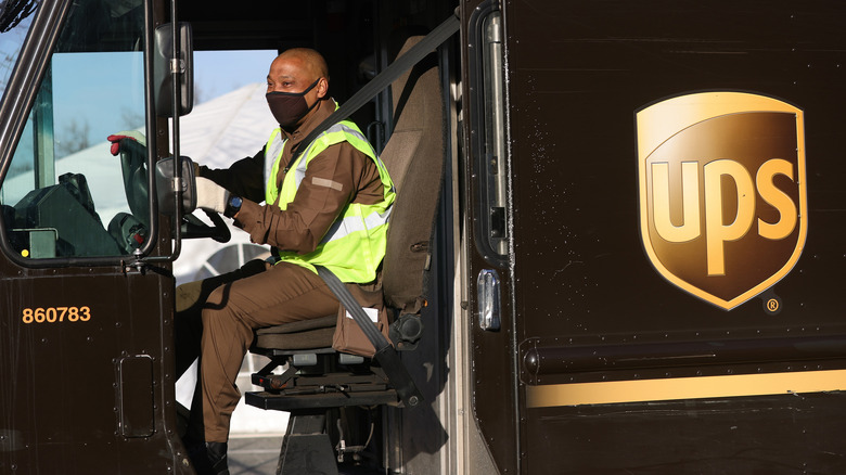 A man driving a UPS van