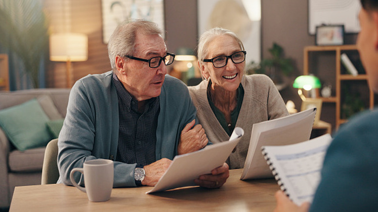 retirees talking with financial professional