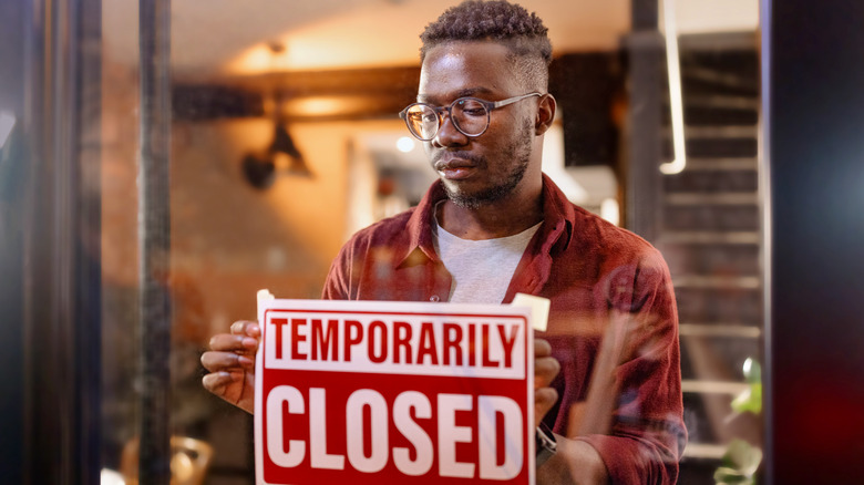 A man posting a sign