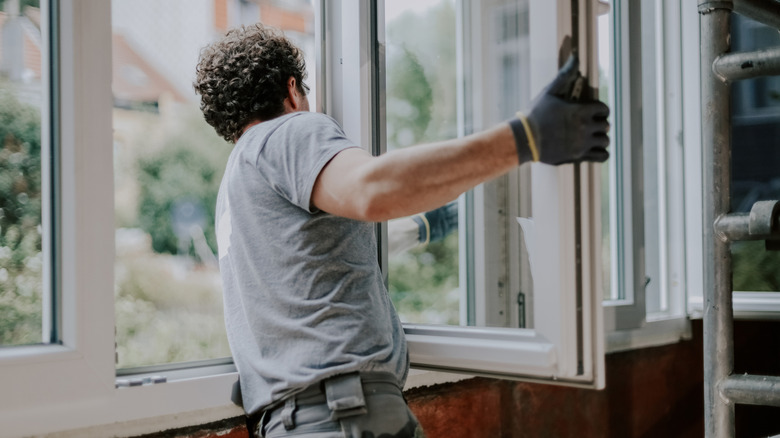 man installing new windows