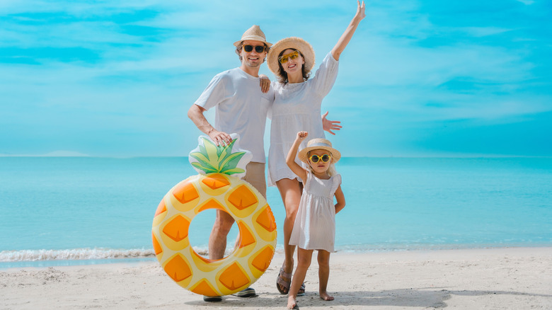 a family on vacation at a beach