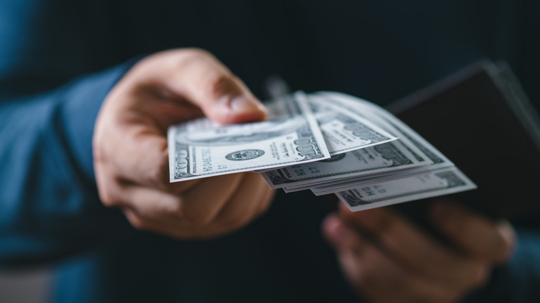 Close up of someone holding cash
