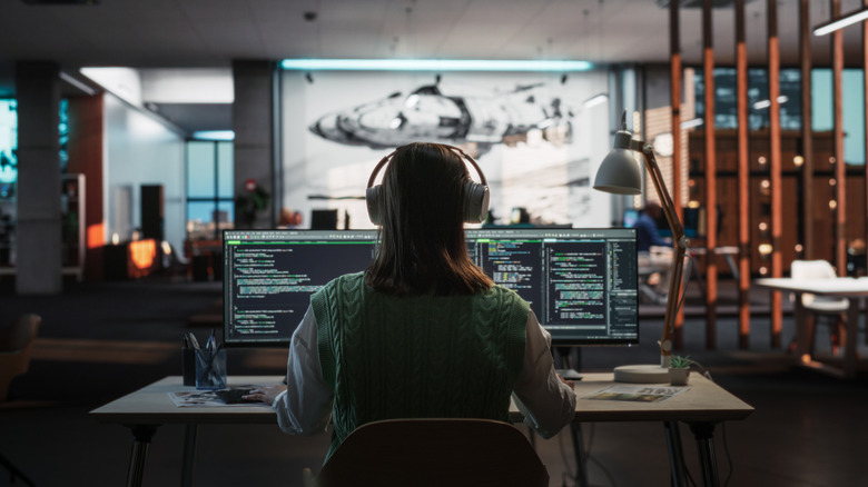 Game designer works on video game.