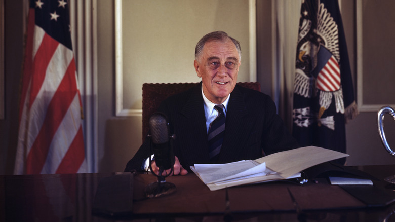 U.S. President Franklin Delano Roosevelt sitting behind a desk