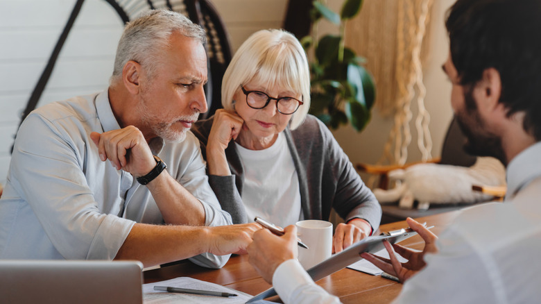 Senior couple meeting with an investment advisor