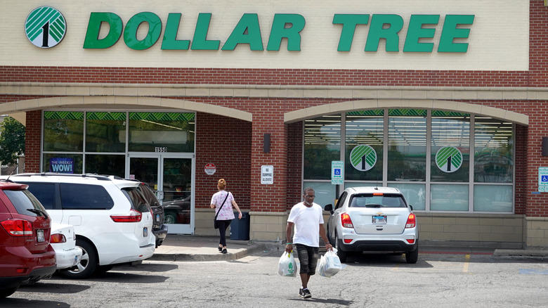 Customers walking in and out of a Dollar Tree