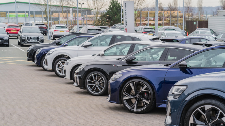 Cars for sale in dealership.