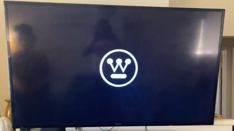 TV with W inside a circle on the screen