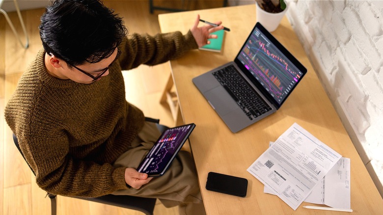 Person reviewing stocks at home