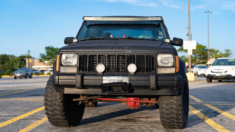 A black Jeep Cherokee in an Illinois parking lot.