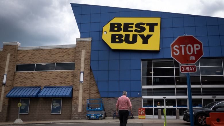 A person walks outside a Best Buy store
